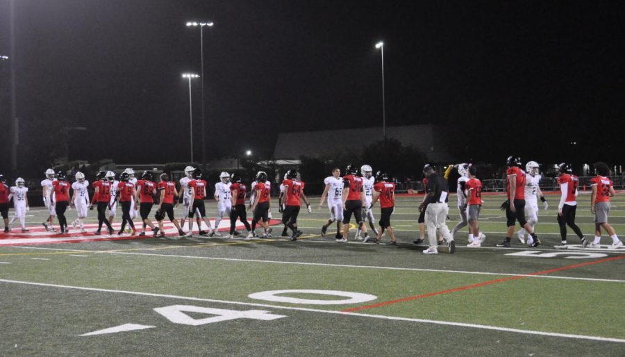Gunn and Paly teams agree to a handshake following the untimely cancellation. 