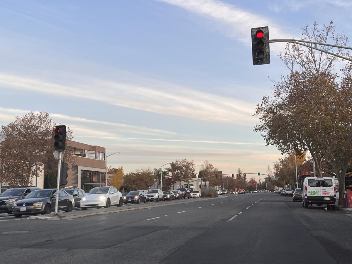 Potholes and cracks on El Camino Real are being repaved with new asphalt concrete.