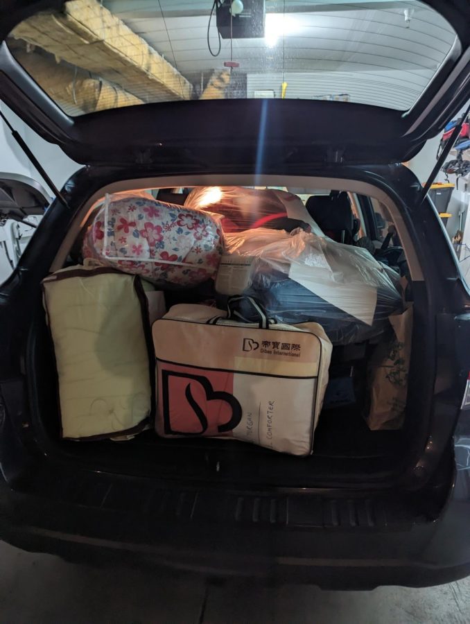 A member of the Turkish American Association of California collects donations in their car 